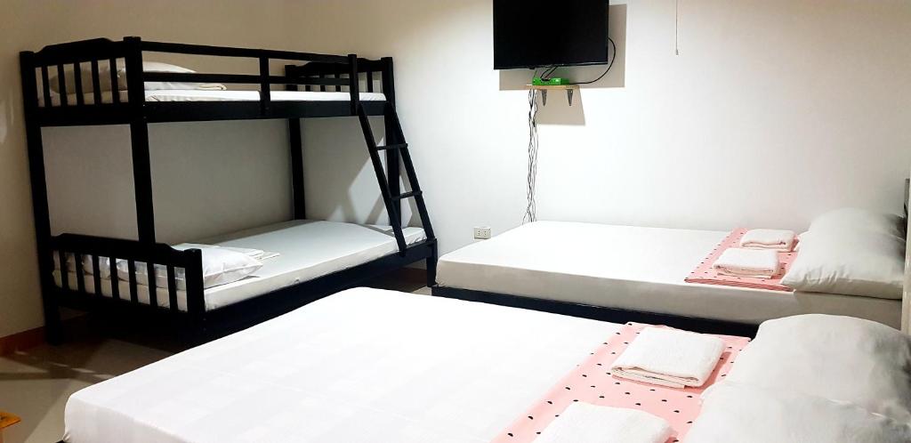 Postel nebo postele na pokoji v ubytování Amelia Homestay
