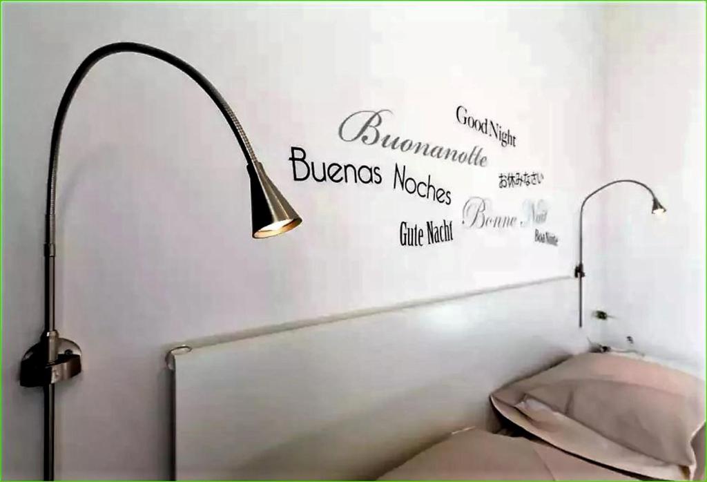 A bed or beds in a room at Carlos BCS2 - Sanremo Center Suite -