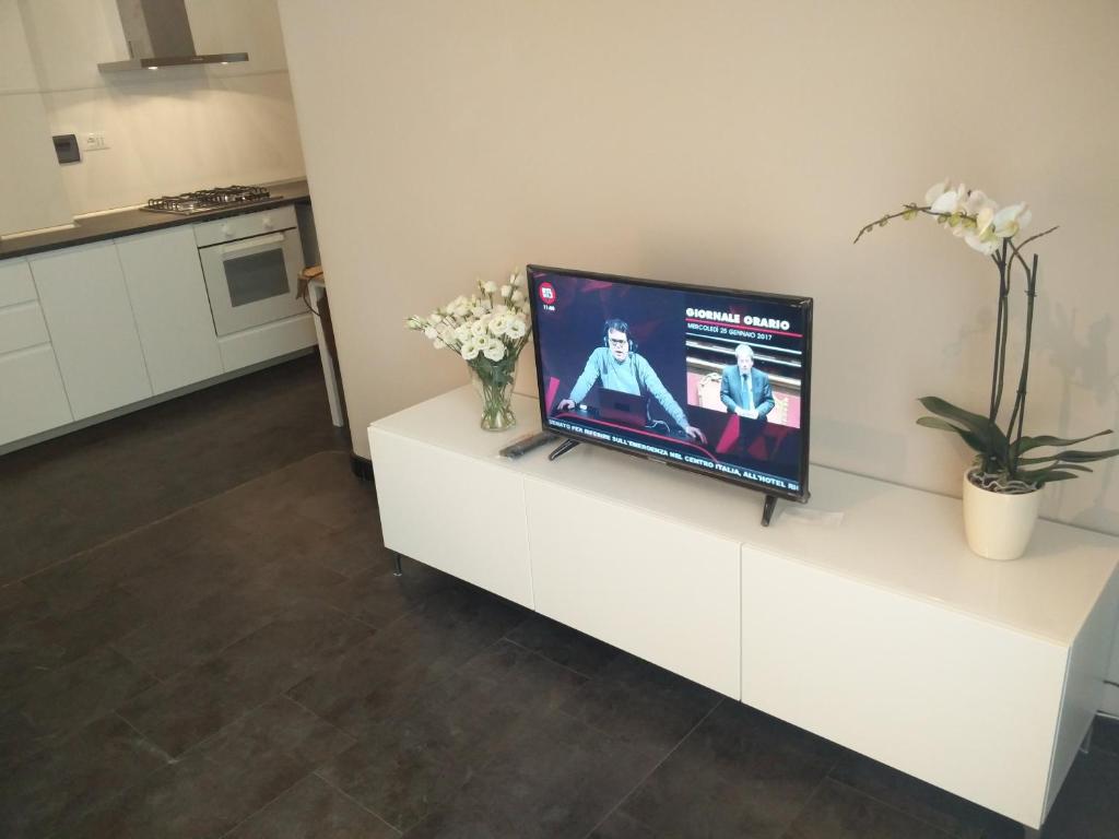 A television and/or entertainment centre at Carlos BCS2 - Sanremo Center Suite -