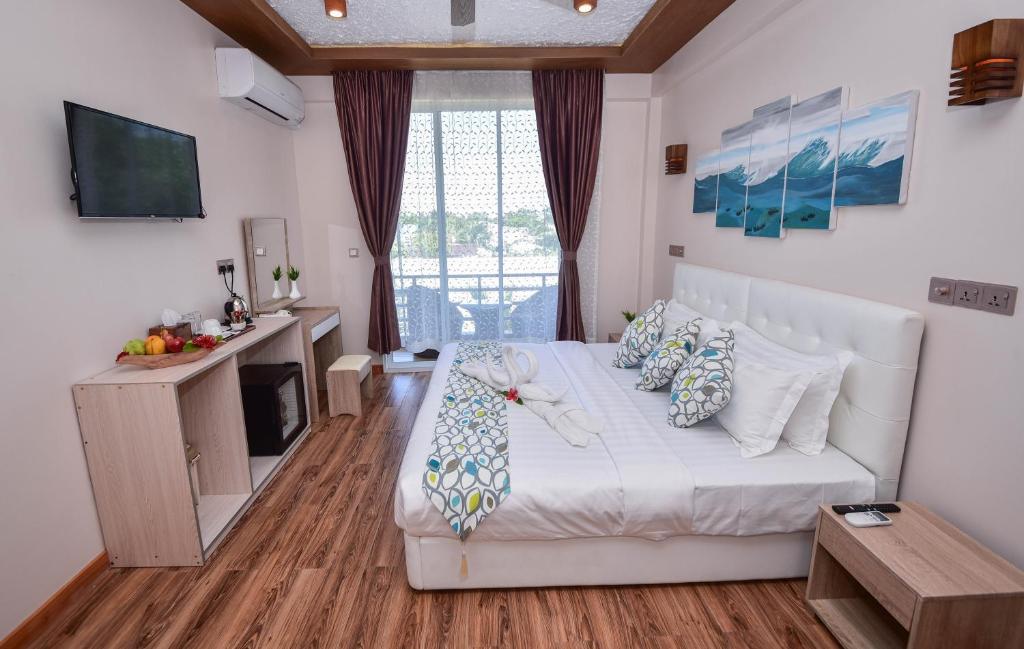 TV a/nebo společenská místnost v ubytování Vilu Thari Inn Maldives
