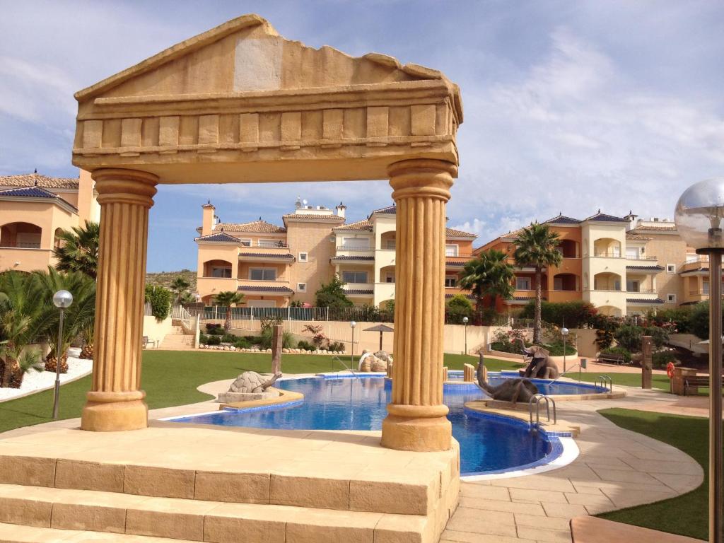 a gazebo with a pool in a park at Residencial Alhambras1 in Murcia