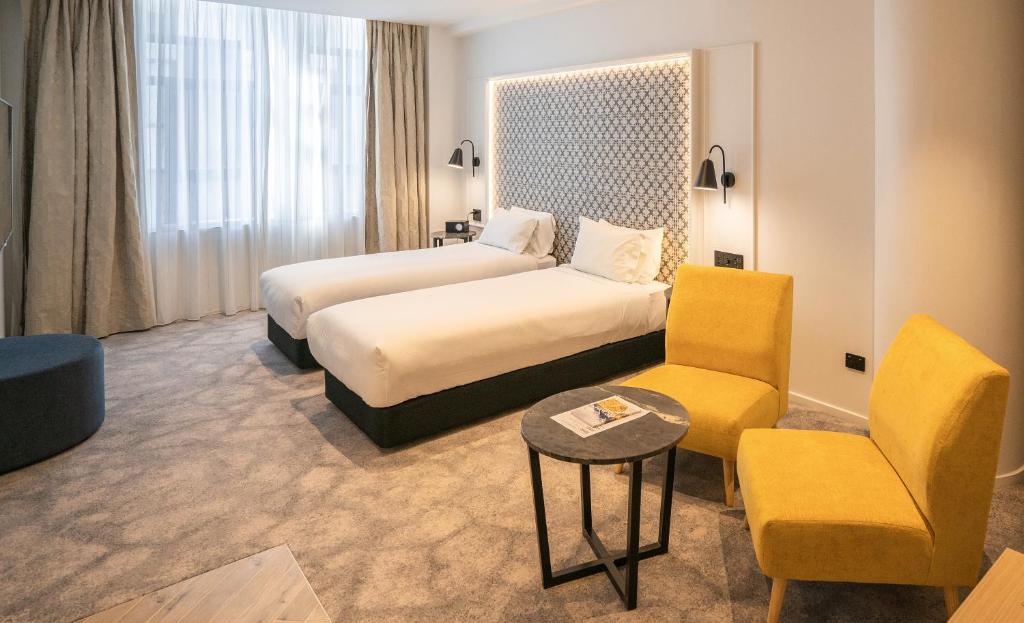 Postel nebo postele na pokoji v ubytování Legacy Airedale Hotel Auckland