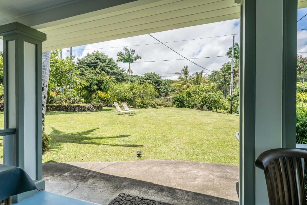 a view of a yard from a porch at Old Hawaiian Bed and Breakfast in Hilo