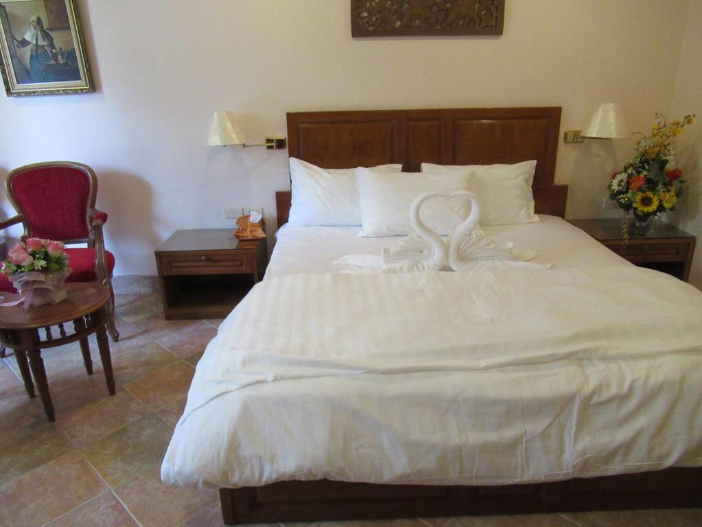 Postel nebo postele na pokoji v ubytování Villa Oranje Pattaya