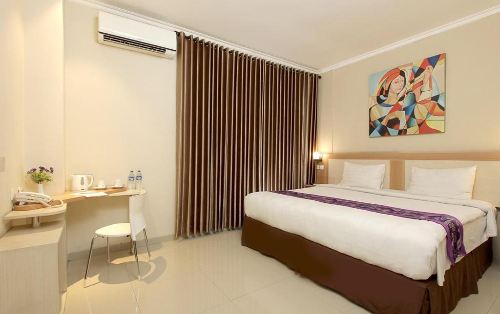 Letto o letti in una camera di Laxston Hotel