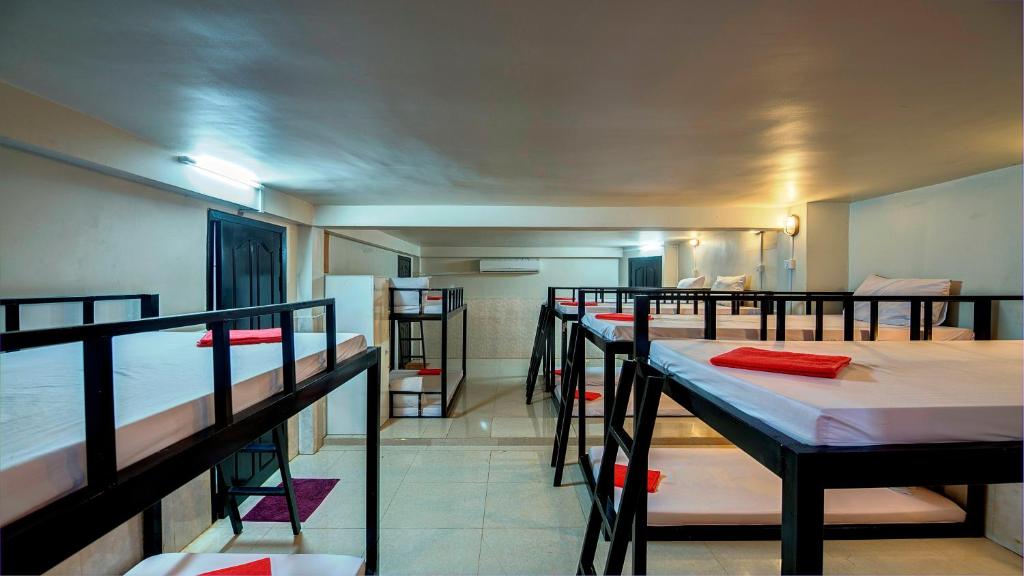a group of bunk beds in a room at Siem Reap Pub Hostel in Siem Reap