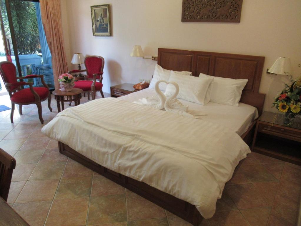 Postel nebo postele na pokoji v ubytování Villa Oranje Pattaya