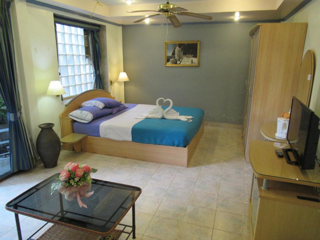 Postel nebo postele na pokoji v ubytování Villa Oranje Pattaya