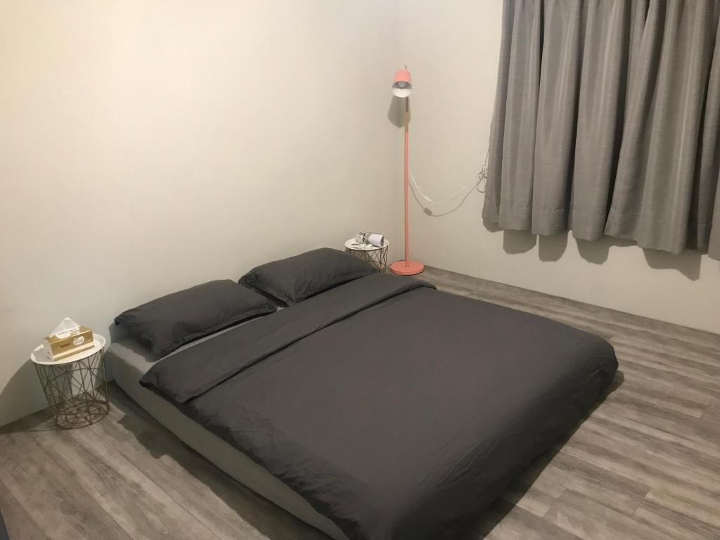 Postel nebo postele na pokoji v ubytování 琉浪潛水背包客棧 Drift Diving Hostel