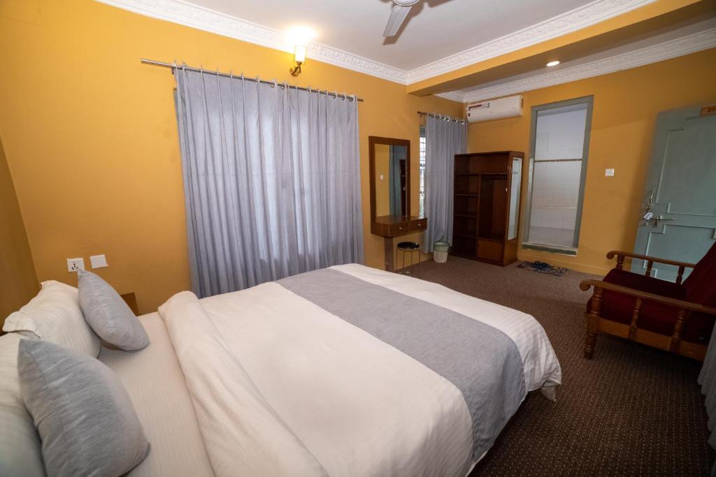 Krevet ili kreveti u jedinici u okviru objekta Gaurishankar Backpackers hostel