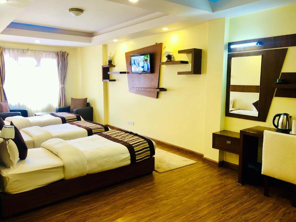 Postel nebo postele na pokoji v ubytování Backyard Hotel