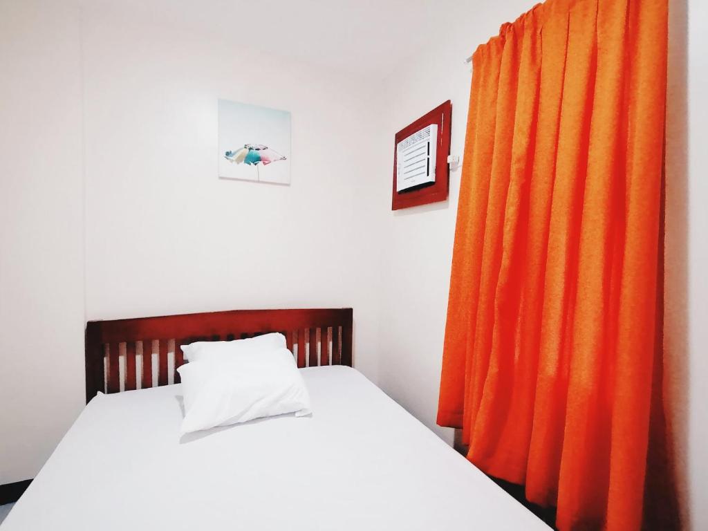 Postel nebo postele na pokoji v ubytování Downtown Suites