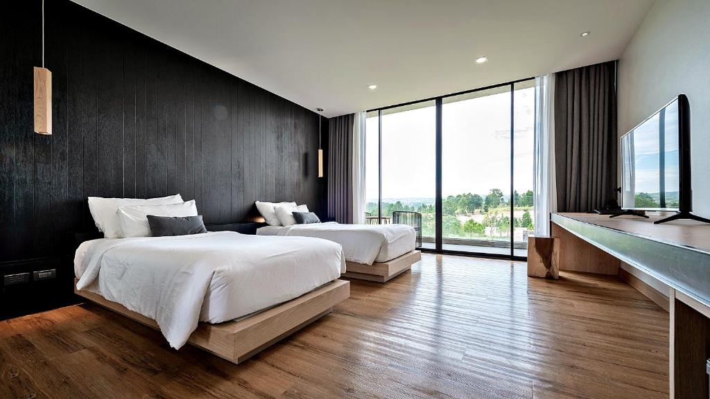 Postel nebo postele na pokoji v ubytování De Capoc Resort