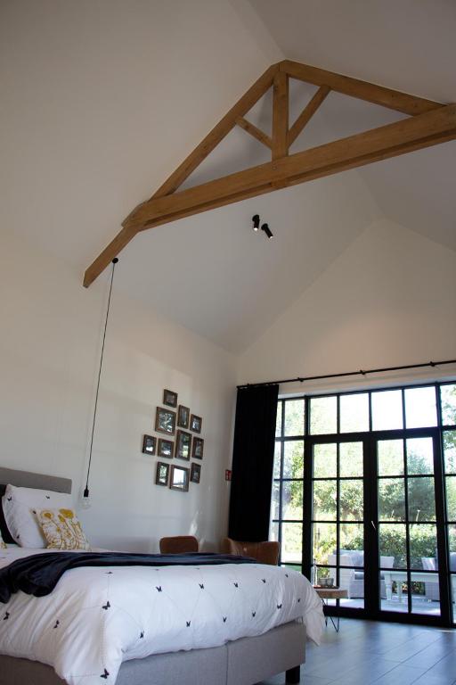 Postel nebo postele na pokoji v ubytování Madelette B&B