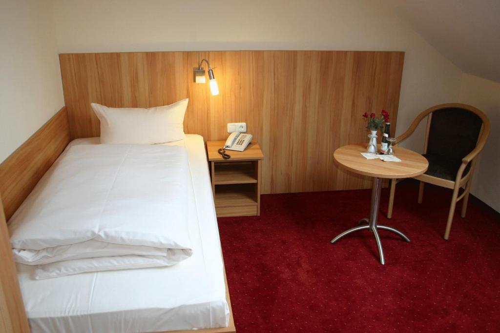 Postel nebo postele na pokoji v ubytování Hotel Accolo