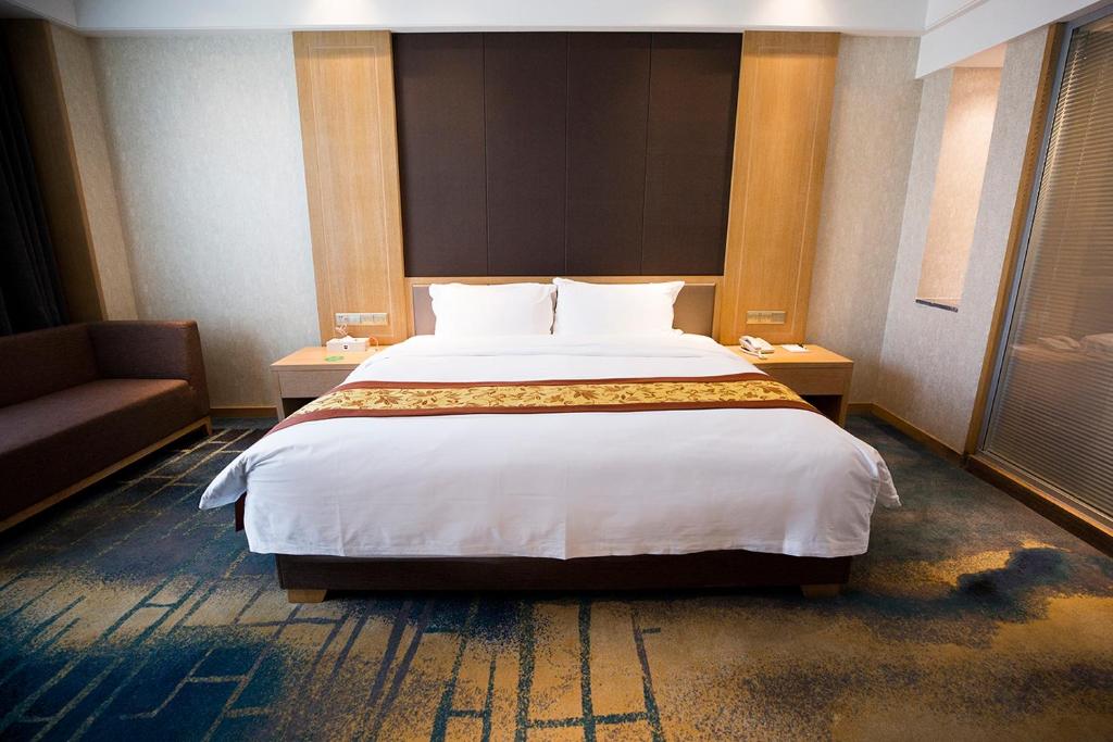 Postel nebo postele na pokoji v ubytování Metropark Hotel Yingkun Beijing