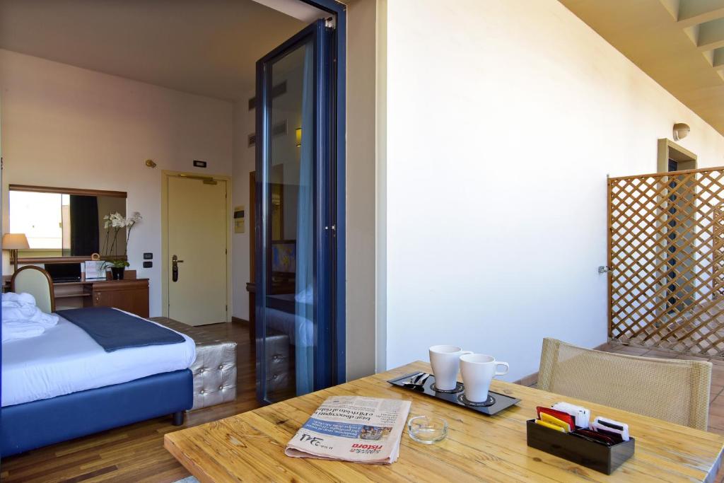 Postel nebo postele na pokoji v ubytování Grand Hotel Tiberio
