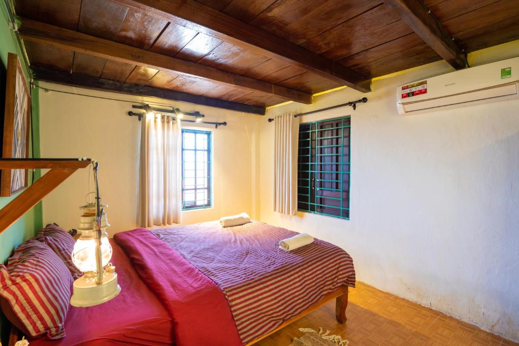 Postel nebo postele na pokoji v ubytování Little Nap Homestay