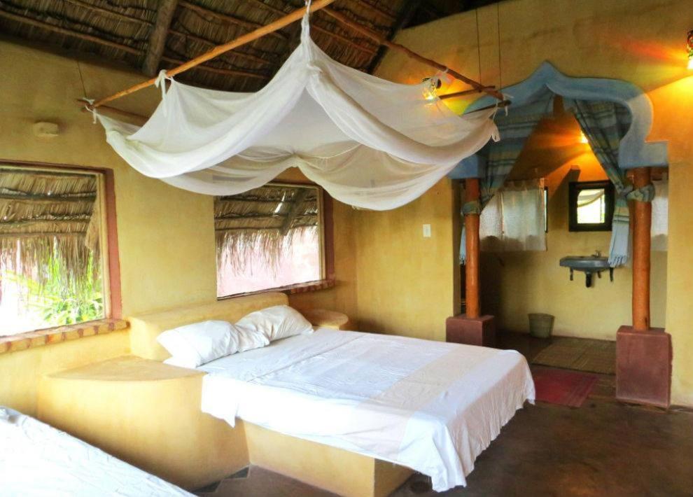 Ένα ή περισσότερα κρεβάτια σε δωμάτιο στο Anastasea, Palm Tree Garden Lodging