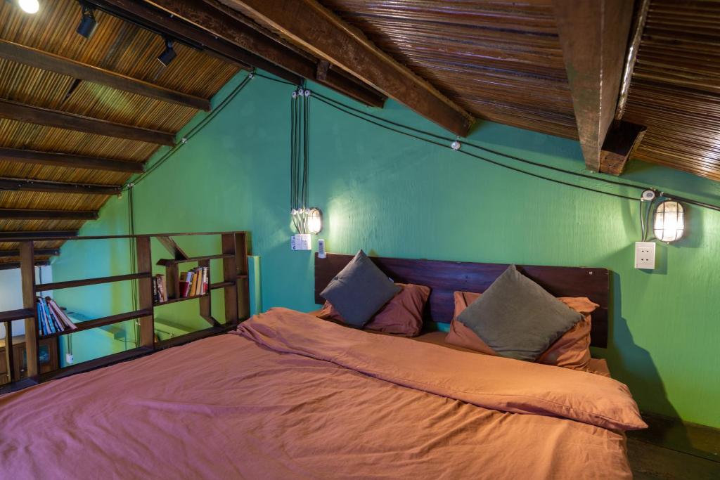 Postel nebo postele na pokoji v ubytování Little Nap Homestay