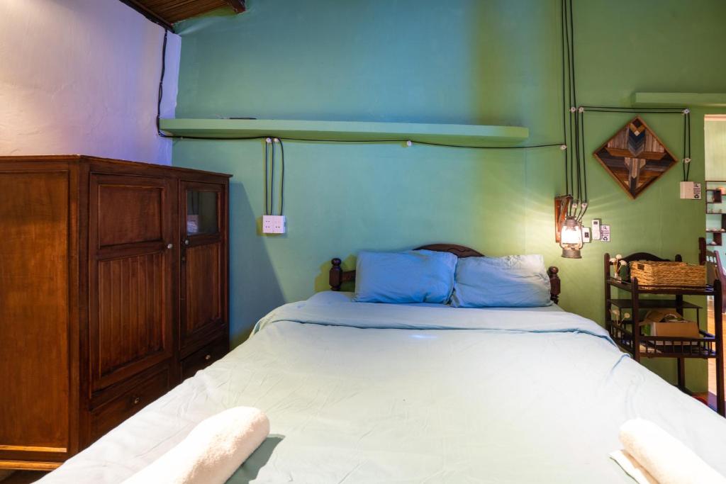Postel nebo postele na pokoji v ubytování Little Nap Homestay