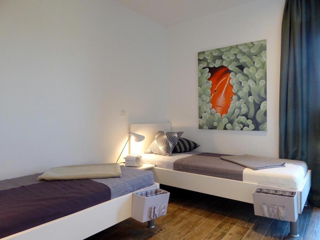 Łóżko lub łóżka w pokoju w obiekcie Apartment Noorderwind, Am Alten Deich 20/6