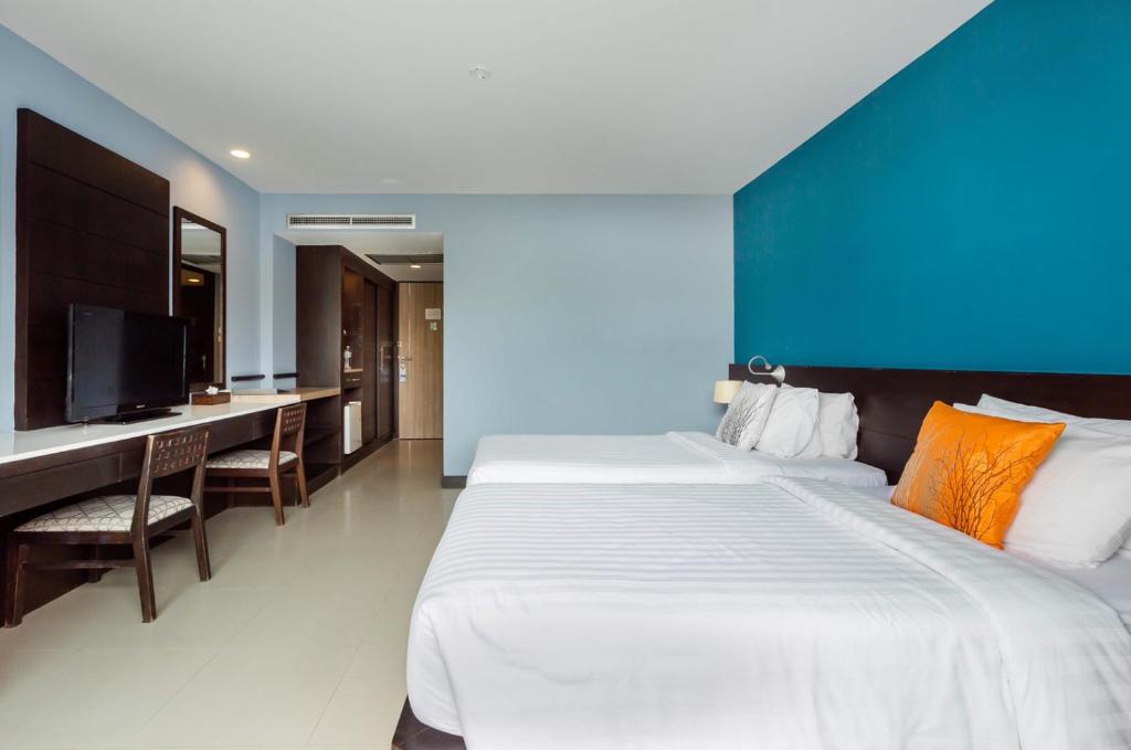 Postel nebo postele na pokoji v ubytování Blue Tara Hotel Krabi Ao Nang