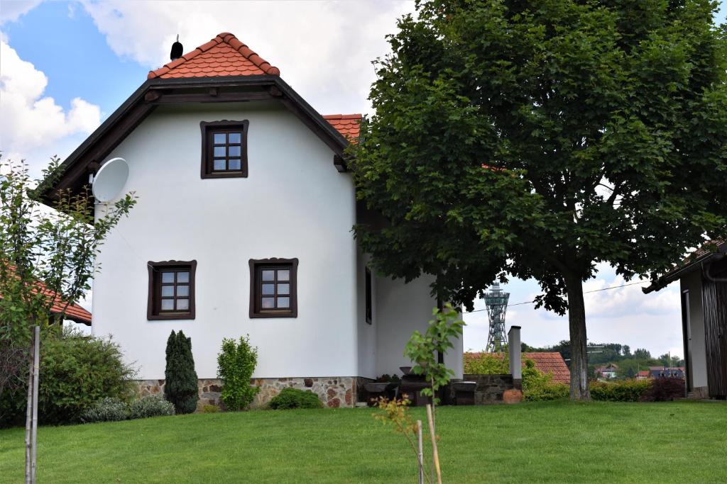 a white house with a red roof at Vila Idila in Lendava