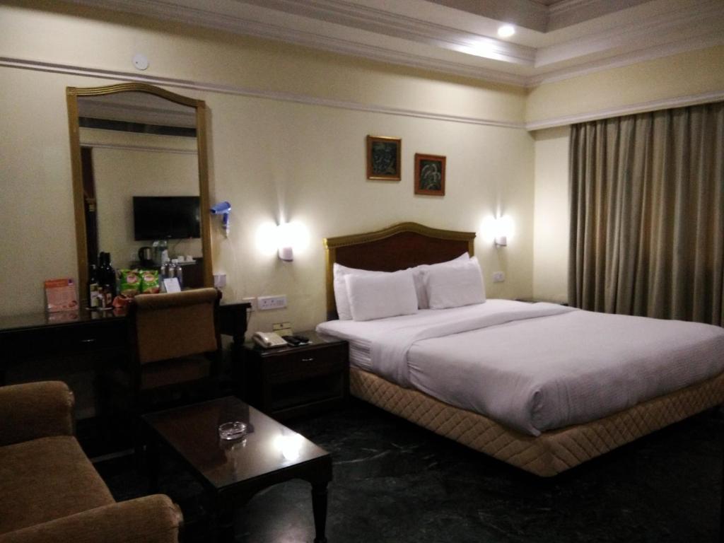 Postel nebo postele na pokoji v ubytování Hotel Empires