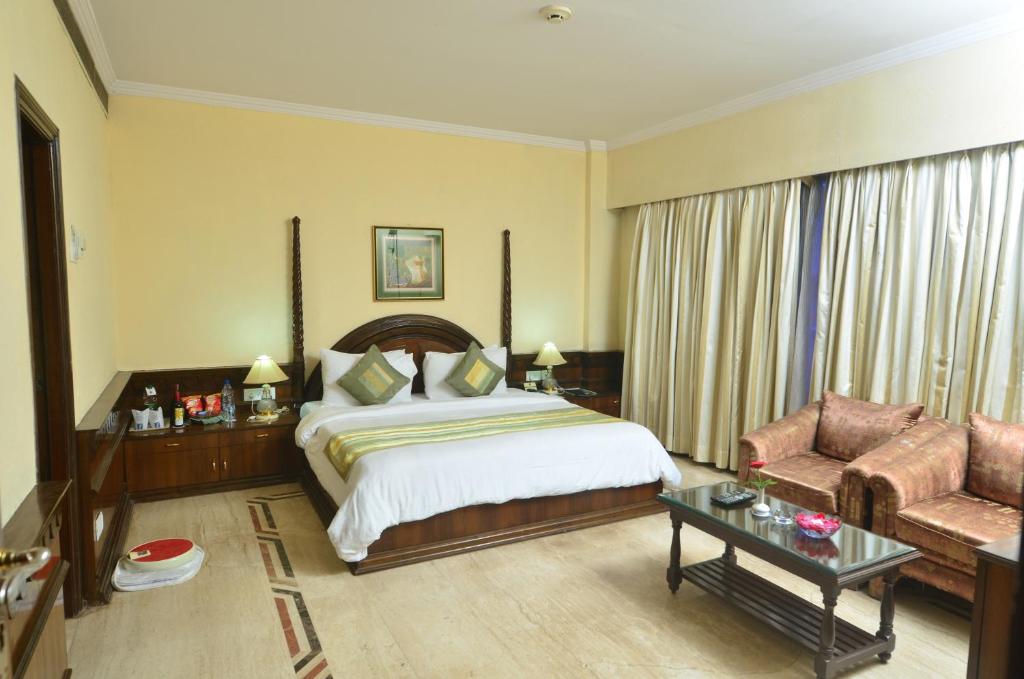 Postel nebo postele na pokoji v ubytování Hotel Empires