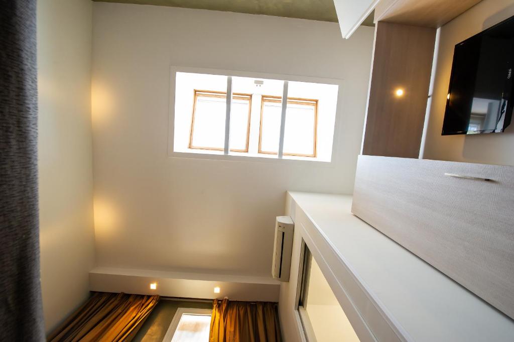 Posteľ alebo postele v izbe v ubytovaní Borgo Pio Suites Inn