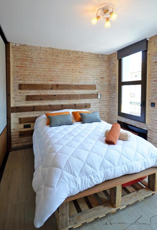 A bed or beds in a room at Casita en el Cabañal con Patio