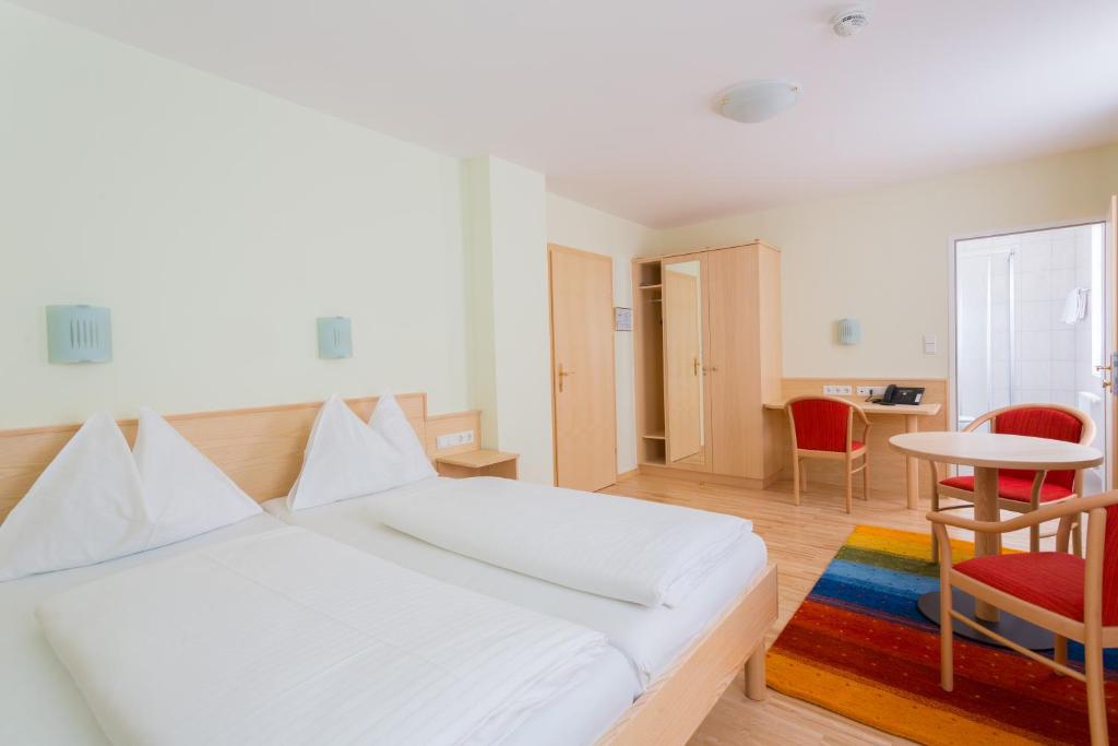 Postel nebo postele na pokoji v ubytování Hotel Kindler 2,0 Self-Check-In
