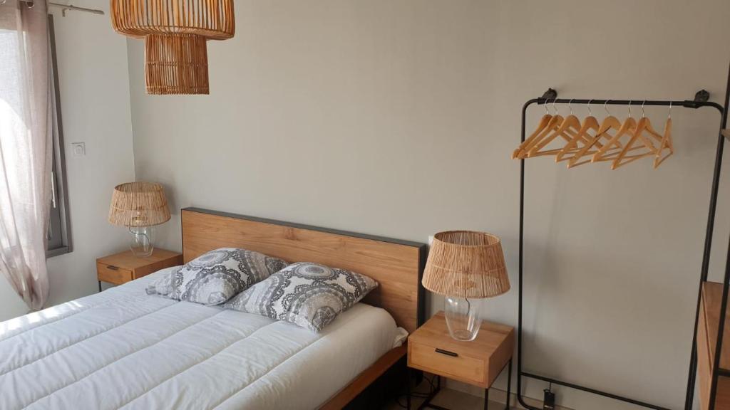 Postel nebo postele na pokoji v ubytování Rélocation vacances de la cote sauvage