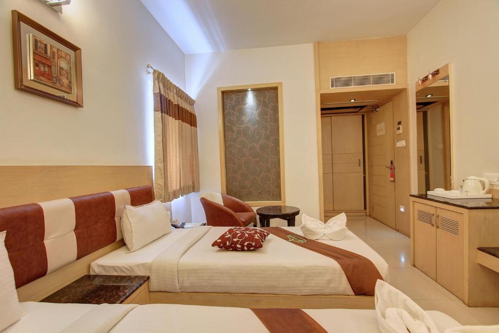 Postel nebo postele na pokoji v ubytování Hotel Prince Gardens