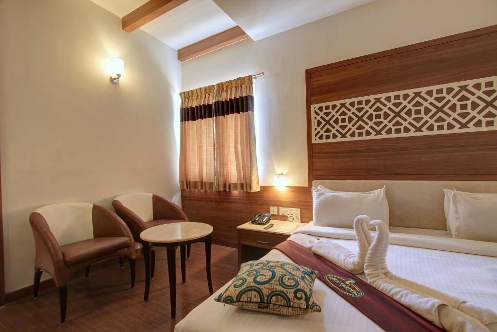 Postel nebo postele na pokoji v ubytování Hotel Prince Gardens