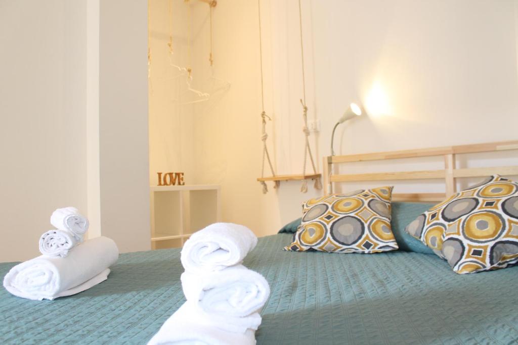 A bed or beds in a room at Dimora Orfeo