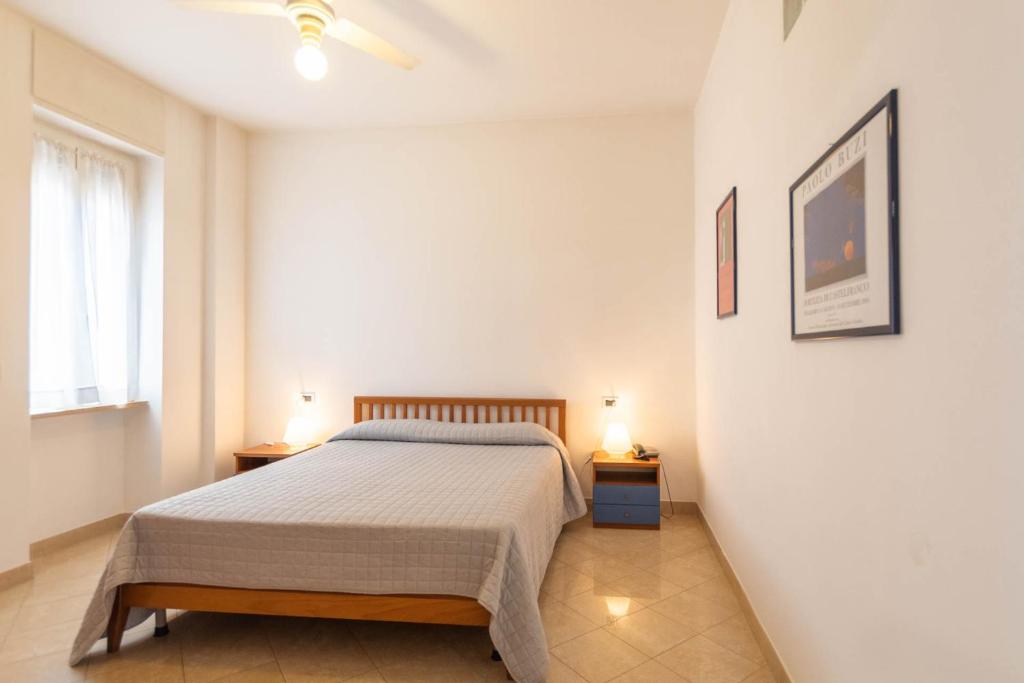 Postel nebo postele na pokoji v ubytování Residenza Adelaide
