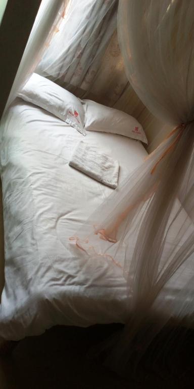 Postel nebo postele na pokoji v ubytování Hotel Jaffers Nairobi