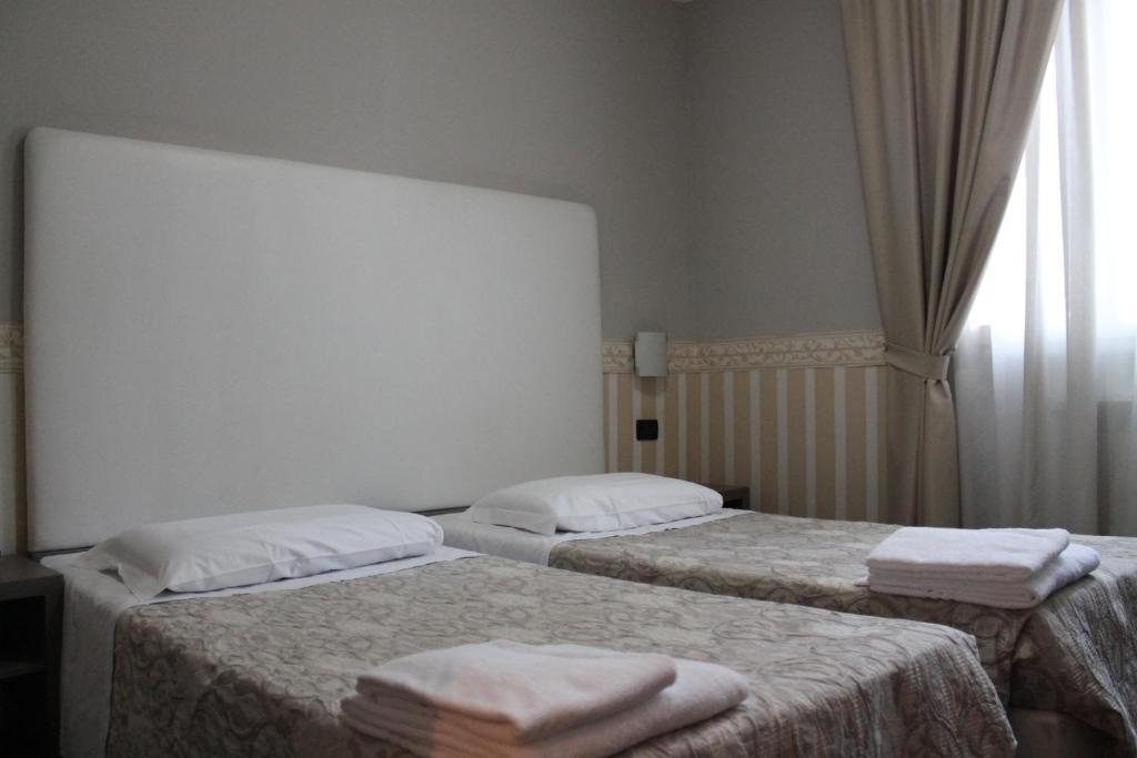 Postel nebo postele na pokoji v ubytování Hotel Laguna Residence