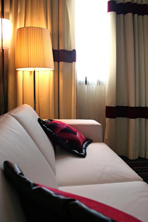 Postel nebo postele na pokoji v ubytování Hotel Filanda