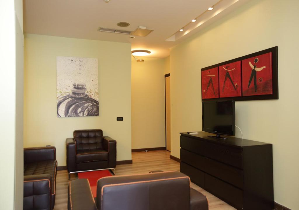TV a/nebo společenská místnost v ubytování Chalkida Seafront Apartment