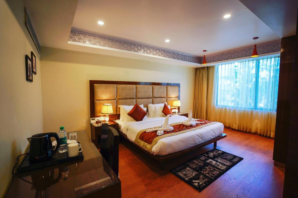 Postel nebo postele na pokoji v ubytování Hotel Indo Prime