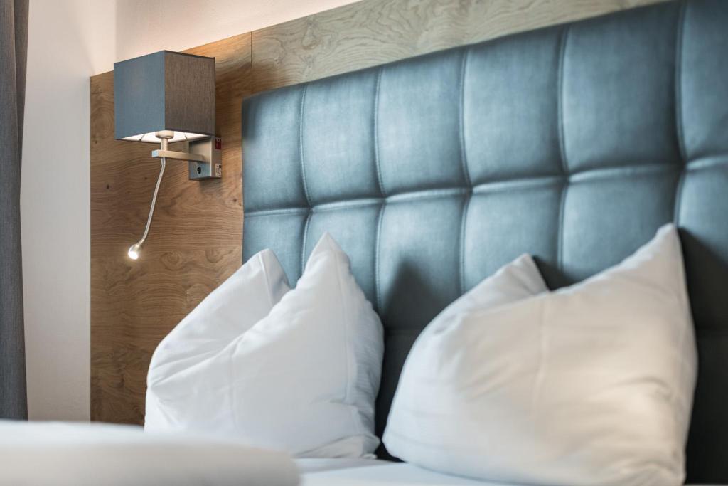 Postel nebo postele na pokoji v ubytování Hotel Plankenhof B&B