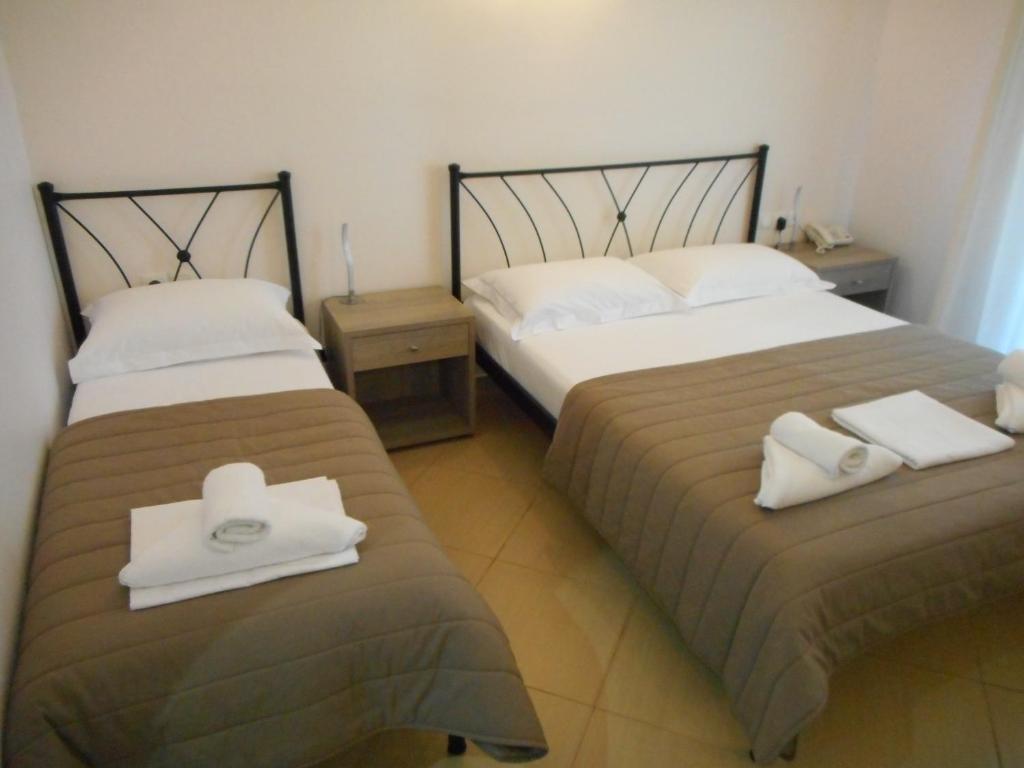 Voodi või voodid majutusasutuse Anesis Hotel toas