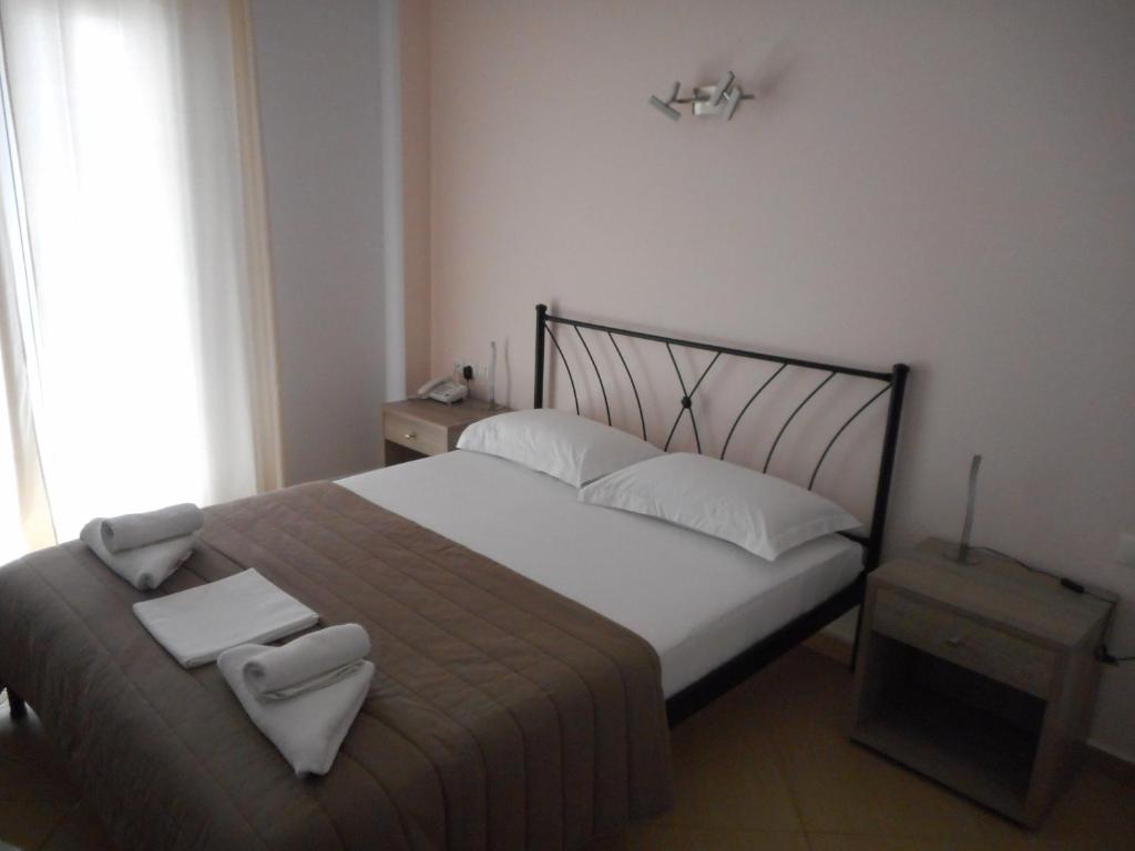 Voodi või voodid majutusasutuse Anesis Hotel toas