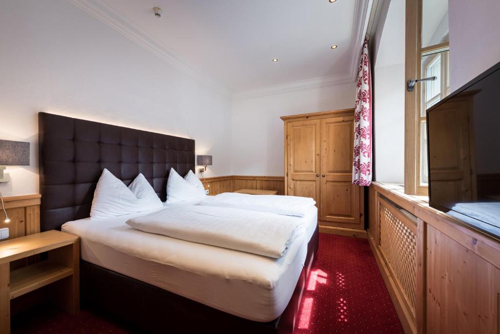 Postel nebo postele na pokoji v ubytování Hotel Plankenhof B&B