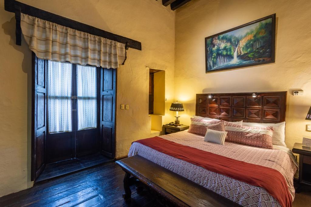 Postel nebo postele na pokoji v ubytování Hotel Mansion Iturbe
