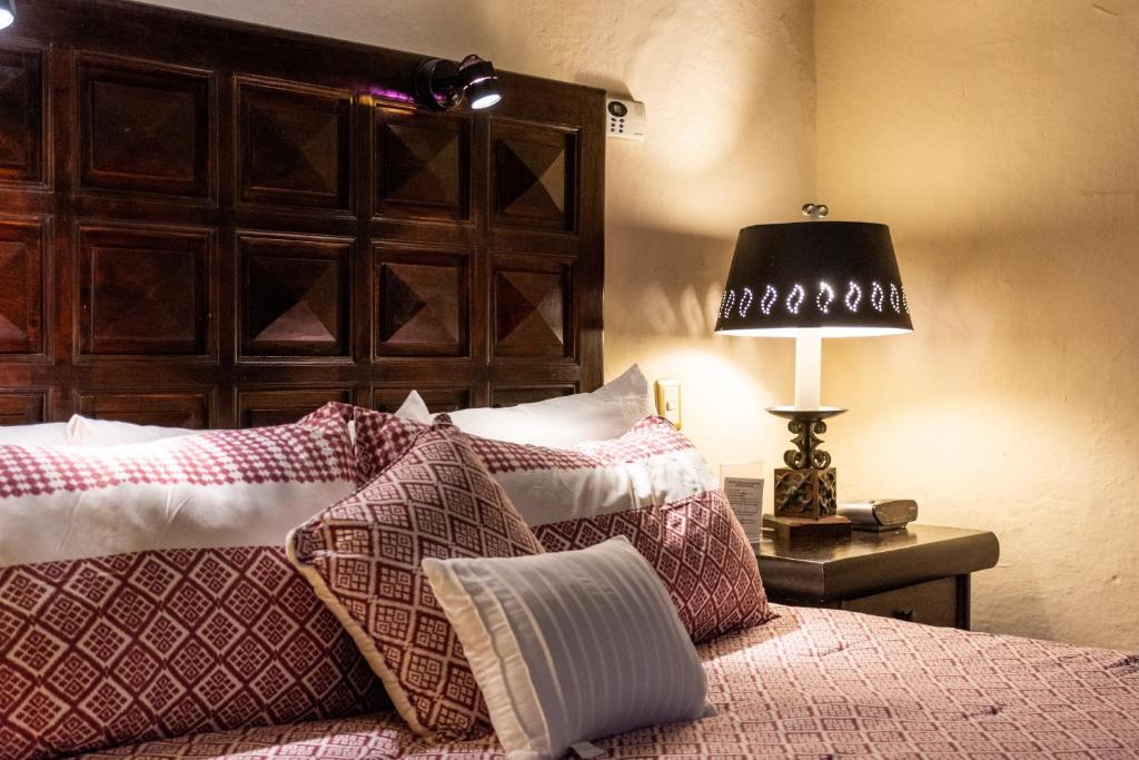 Postel nebo postele na pokoji v ubytování Hotel Mansion Iturbe