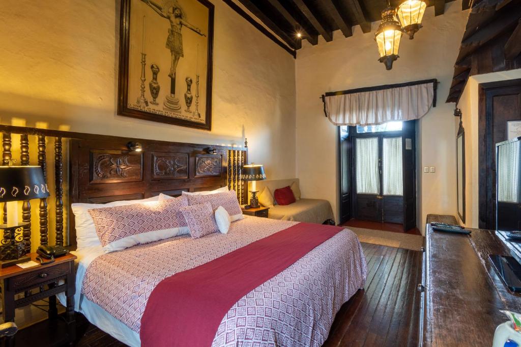 Postel nebo postele na pokoji v ubytování Hotel Mansion Iturbe